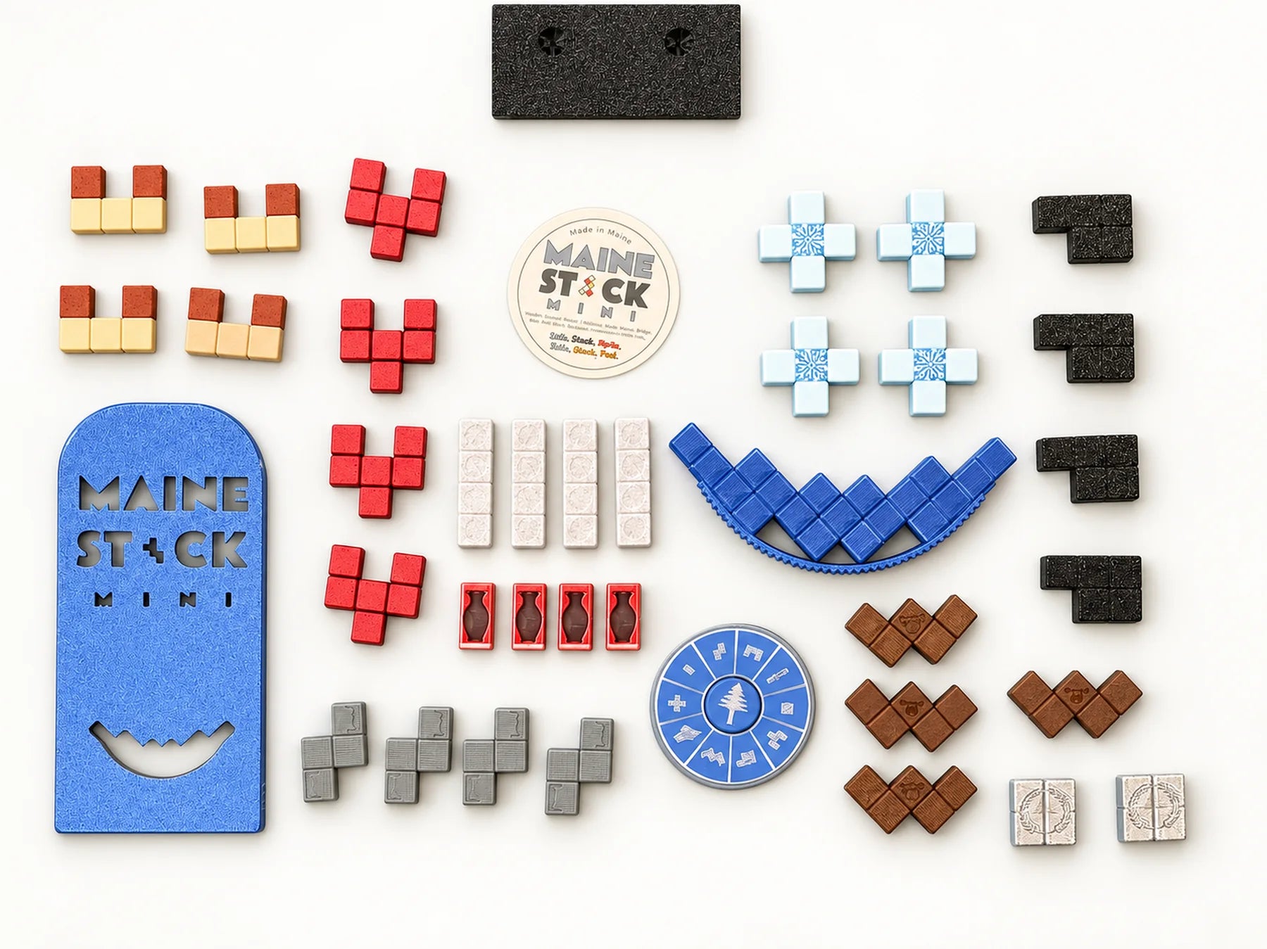 Complete Maine Stack Mini game laid out with every piece, spinner, rocker, and cover.
